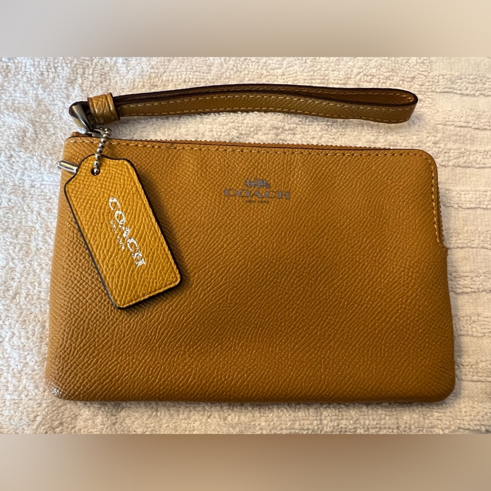 Coach golden yellow wristlet.